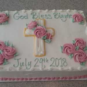 Cross and Pink Rosettes Cake